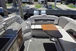 Four Winns H350 - 2019 Four Winns H350 boat interior with seating and table at dock.