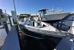 Monterey 328SS - 2015 Monterey 328SS boat docked at marina under clear blue sky.