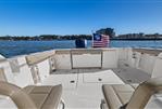 Pursuit OS 355 Offshore - 2018 Pursuit OS 355 Offshore boat interior with American flag on water.