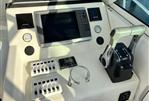 Pursuit 2800 Open - 1992 Pursuit 2800 Open boat dashboard with Garmin navigation and Suzuki controls.