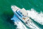 Prestige 420 - Aerial view of 2020 Prestige 420 yacht cruising on turquoise waters.