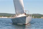 J Boats J/35 - 1984 J Boats J/35 sailing on a calm lake with scenic hills in the background.