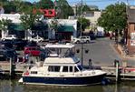 Sabreline 36 Aft Cabin Trawler - 1995 Sabreline 36 Aft Cabin Trawler docked in a bustling marina.