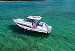 Jeanneau Leader 10.5 S2 - 2025 Jeanneau Leader 10.5 S2 boat on clear turquoise water.