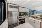 Prestige 590 flybridge - Luxurious kitchen interior of 2024 Prestige 590 flybridge yacht with modern appliances.