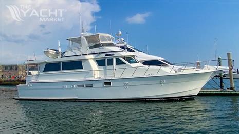 Hatteras 62 Cockpit Motor Yatch - 1990 Hatteras 62 Cockpit Motor Yacht docked on a sunny day.