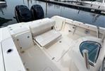 Pursuit C 280 Center Console - 2012 Pursuit C 280 Center Console boat interior with seating and twin engines at dock.