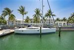 Hunter 50ac - Hunter 50ac 2010 sailboat named The Journey docked at a marina with palm trees.