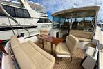 MJM 50z - Luxurious 2017 MJM 50z yacht with spacious outdoor seating and elegant wooden table.