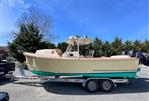 Padebco V27 Center Console - 2003 Padebco V27 Center Console boat on trailer, parked outdoors.