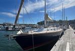 Tartan 4100 - Tartan 4100 sailboat docked at marina under clear blue sky, 2003 model.