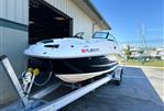 Sea Ray 260 Sundeck - 2014 Sea Ray 260 Sundeck on trailer outside dealership.