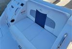 Chaparral 327 SSX - 2013 Chaparral 327 SSX boat with white and blue cushioned seating.