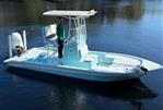 Shallow Sport 24 Mod V - 2021 Shallow Sport 24 Mod V boat on calm water with a person standing.