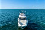 Prestige 420 - Prestige 420 yacht, 2020 model, cruising on open blue sea under clear sky.