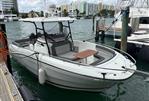 Jeanneau Leader 9.0 CC - 2023 Jeanneau Leader 9.0 CC boat docked in marina, overcast sky.