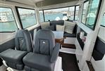 Axopar 37 XC - Interior of 2020 Axopar 37 XC boat with luxurious seating and waterfront view.