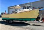 Padebco V27 Center Console - 2003 Padebco V27 Center Console boat on trailer, parked outside a warehouse.