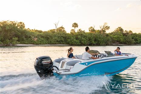 Bayliner M17 - 2024 Bayliner M17 boat cruising on a scenic waterway.