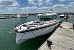 Axopar 37 XC - 2020 Axopar 37 XC boat docked at a marina on a sunny day.