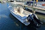 Pursuit 2800 Open - 1992 Pursuit 2800 Open boat docked with twin Suzuki outboard motors.