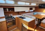 Grand Soleil 47 - Modern kitchen and dining area inside a 2015 Grand Soleil 47 sailboat.