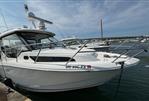 Boston Whaler 325 Conquest Pilothouse - 2020 Boston Whaler 325 Conquest Pilothouse docked in marina, side view.