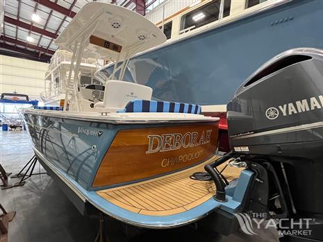 Vanquish 26 - 2021 Vanquish 26 boat with Yamaha engine in a storage facility.