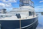 Sabreline 36 Aft Cabin Trawler - 1995 Sabreline 36 Aft Cabin Trawler docked under blue sky.