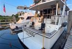 Southern Cross 53 - 1986 Southern Cross 53 yacht docked, featuring spacious deck and American flag.