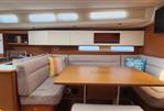 Grand Soleil 47 - Interior of 2015 Grand Soleil 47 yacht with cozy dining area and modern design.