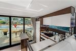 Prestige 520 - Luxurious interior of 2024 Prestige 520 yacht with modern kitchen and large windows.