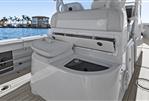 Yellowfin 36 Offshore - 2016 Yellowfin 36 Offshore boat interior with storage compartment open, near waterfront.