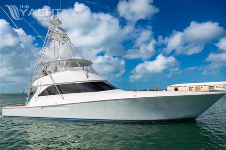 Viking Sportfish - 2006 Viking Sportfish yacht on water under blue sky with clouds.