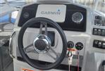 Jeanneau Leader 7.5 WA - Steering console of 2021 Jeanneau Leader 7.5 WA with Garmin navigation system.