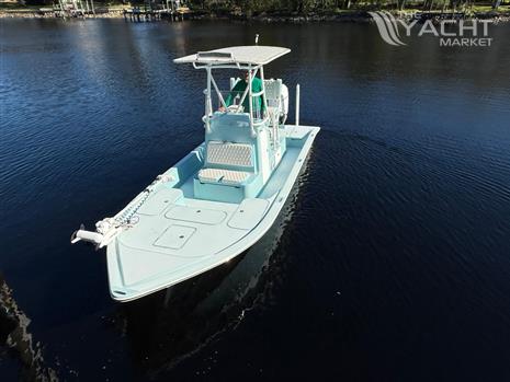 Shallow Sport 24 Mod V - 2021 Shallow Sport 24 Mod V boat on calm water, aerial view.