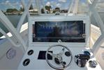 SeaHunter 33 - 2018 SeaHunter 33 boat helm with steering wheel and control panel.