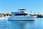 Southern Cross 53 - 1986 Southern Cross 53 yacht on calm water, clear blue sky background.