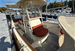 Hinckley Talaria 29C - 2013 Hinckley Talaria 29C boat docked, featuring elegant seating and classic design.