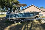 Scout 215 XSF - 2018 Scout 215 XSF boat on trailer, parked in a yard.