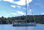 Grand Soleil 47 - Grand Soleil 47 sailboat, 2015 model, anchored in a serene bay with lush greenery.