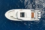 Regal 38 SAV - Aerial view of 2020 Regal 38 SAV yacht on blue ocean water.