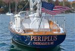 Hinckley Bermuda - 1967 Hinckley Bermuda sailboat "Periplus" with American flag, Chebeague Island, Maine.