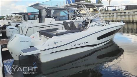 Jeanneau Leader 7.5 WA - 2021 Jeanneau Leader 7.5 WA boat docked, featuring sleek design and Mercury outboard engine.