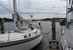 Southern Cross 39 - 1984 Southern Cross 39 sailboat docked at a marina on a cloudy day.