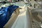 Sea Ray 500 - Interior of 1995 Sea Ray 500 yacht with white seating and covered controls.