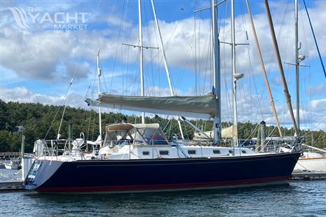 Tartan 4100 - 2003 Tartan 4100 sailboat docked on a sunny day with blue skies.