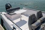 Axopar 22 Spyder - 2021 Axopar 22 Spyder boat interior with seating and table on water.