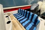 Vanquish 26 - Vanquish 26 boat interior with blue striped seating, 2021 model, featuring dual outboard motors.