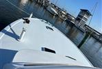 Post 43 - Boat docked at marina, Post 43 model, 1989, with clear blue sky.